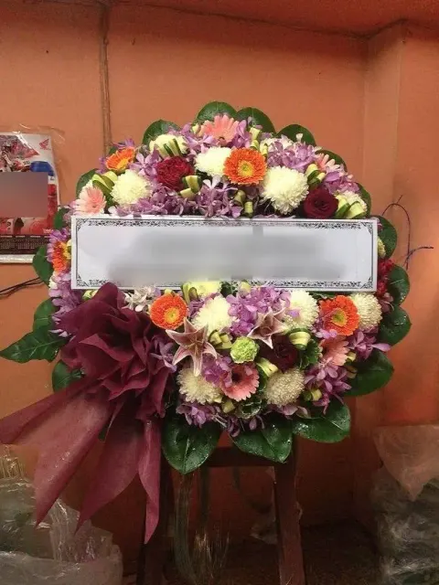พวงหรีดกล้วยไม้ โทนชมพูส้มม่วง